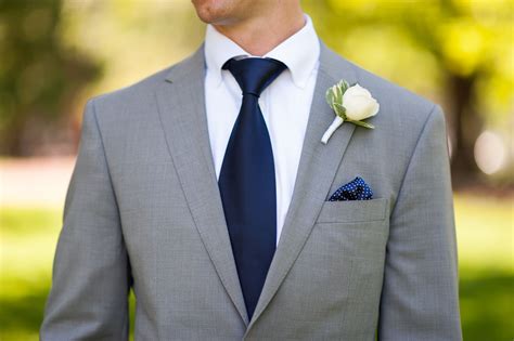 navy suit with grey tie.